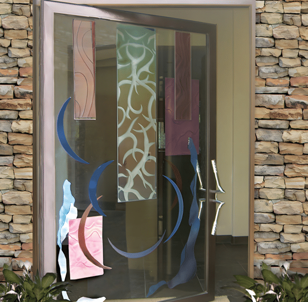 An all aluminum pivot door created with stained glass effect and silver hardware finish.