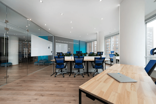 A contemporary office meeting room with tempered glass windows and doors.