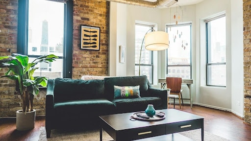 An image of double-glazed windows in a living room during summer.